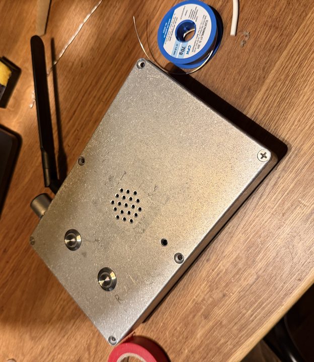 The closed box seen from above with an R scratched next to the Record button